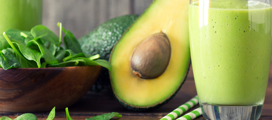 My Fav Keto-Alkaline Shake image of shake in glass, avocado and greens.