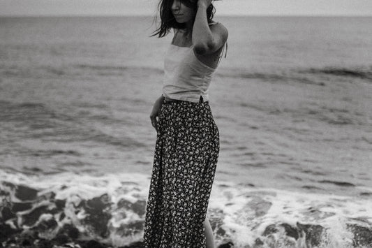 Woman on the beach standing in the waves