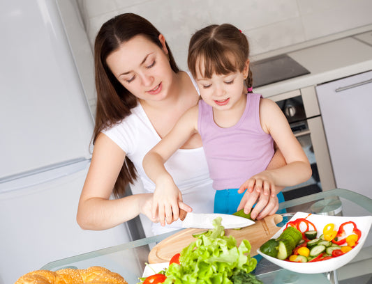 Mom and daughter making a salad together