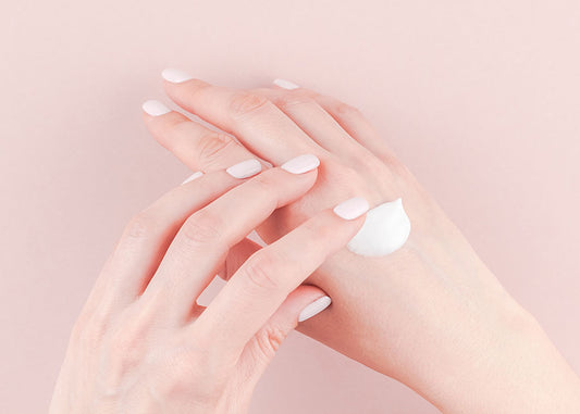 Woman's hands rubbing in some cream