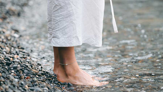 Grounding. Standing barefoot in a stream