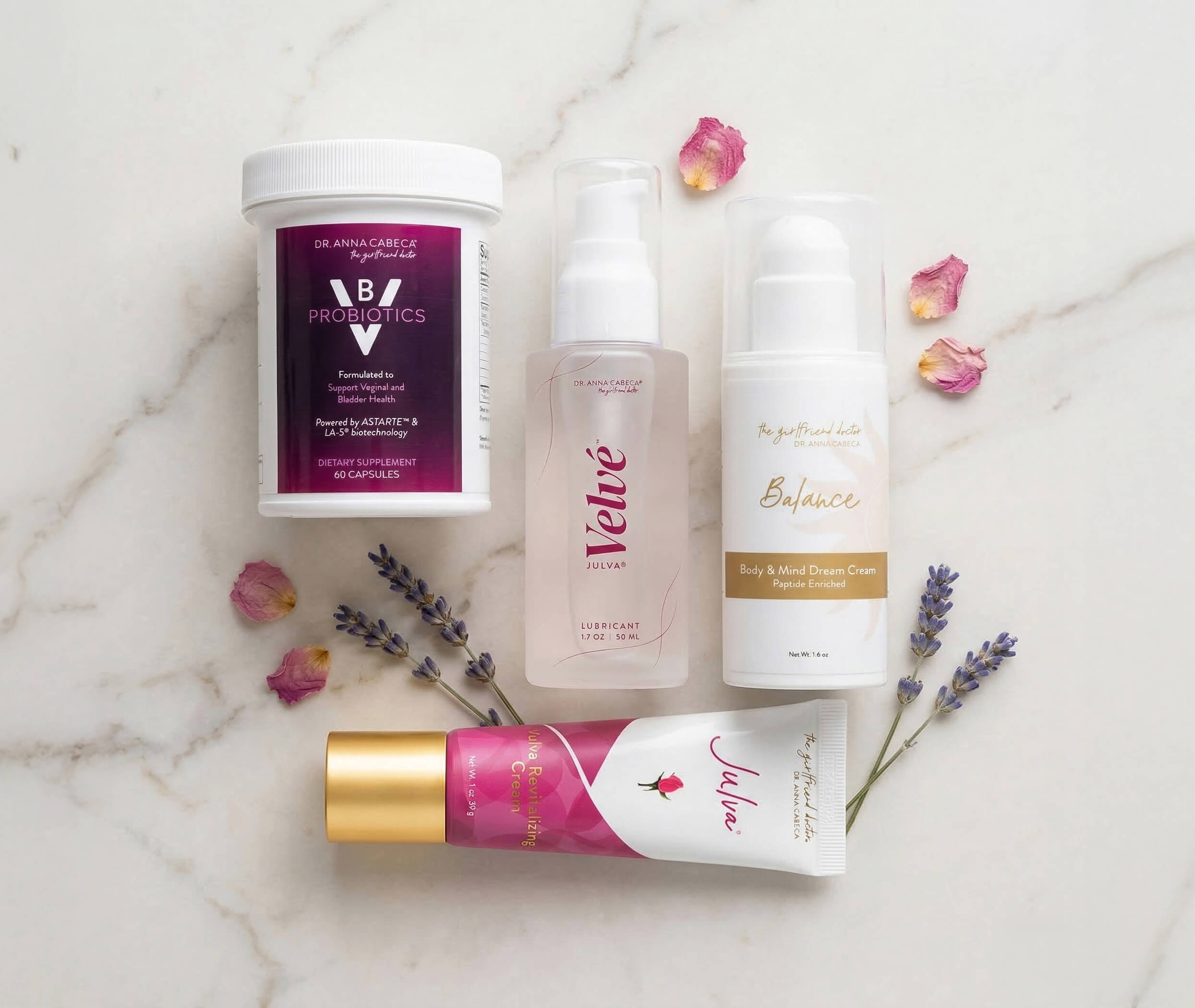 VB Probiotics, Velve, Balance, and Julva on a marble surface with flowers.