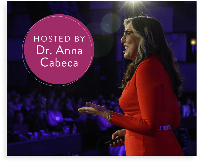 Dr. Anna Cabeca in red speaking on stage 