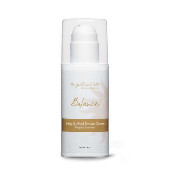 White cream bottle labeled 'Balance' on a black background