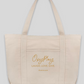Canvas tote bag printed with "Oxyplay. Laugh. Love. Give. dranna.com"